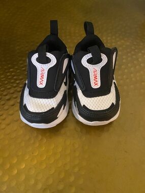 Nike babys Black and White Air Max Slip-On Sneakers with Orange-Red Logo